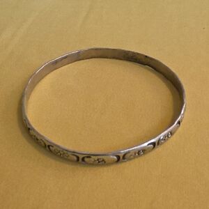 Vintage silver bangle featuring etched or stamped flower designs, stamped Mexico